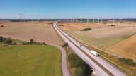 istock Traffic on a highway in a countryside landscape with wind turbines 1428652388