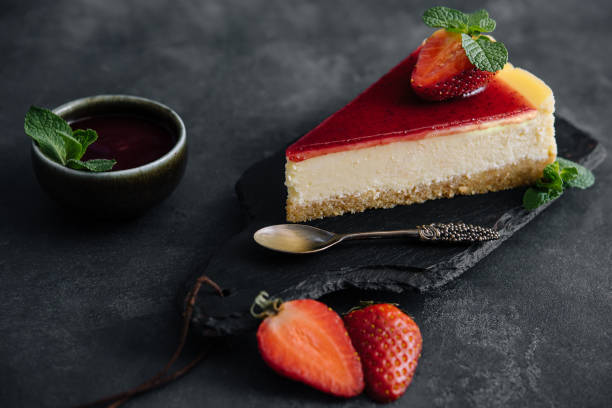 istock Strawberry cheesecake slice close up on a dark 1428656734