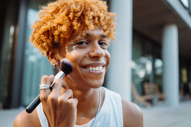 istock African american visagist holding brush and preparing makeup 1428657013