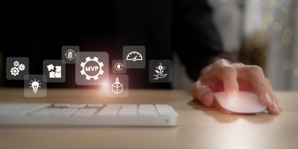 istock MVP, minimum viable product concept for lean startup. New product release planning. Analysis and market validation. Working on computer with  MVP and learn, build, measure icons on smart background. 1428661489