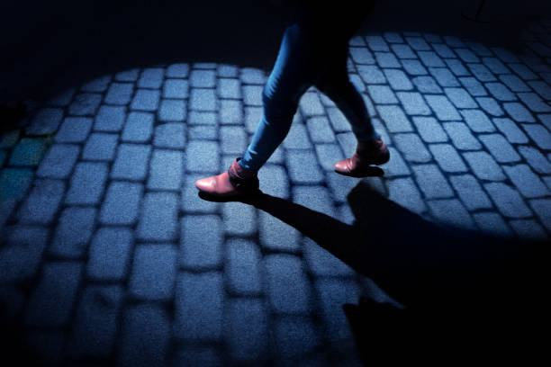 istock Walking on cobblestone street at night 1428663495