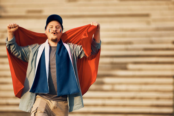 istock Happy soccer fan having fun while cheering for his favorite team during the world cup. 1428669639