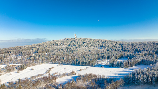 Aerial view of Taunus mountains on a sunny and cold winter day. Feldberg