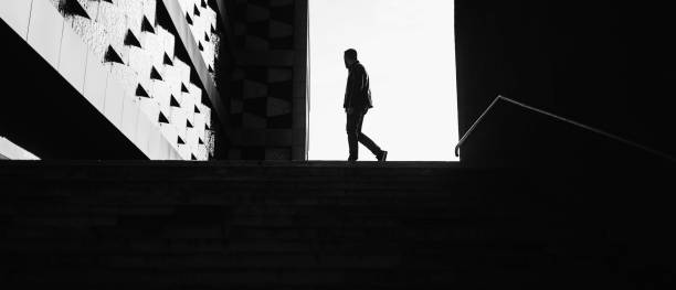 istock silhouette of a walking man 1428670811