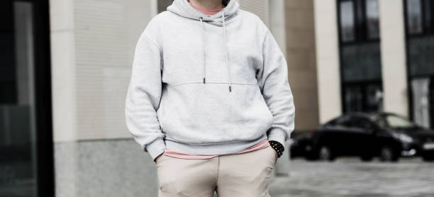 istock man wearing gray blank hoodie. 1428670818