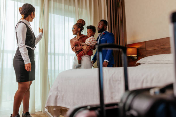 istock Concierge showing view to wealthy guests. 1428670851