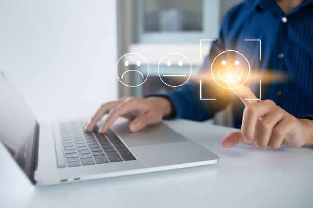 istock Satisfaction and customer service survey concept, business people using  laptop. to answer the questionnaire And the satisfaction rating, the satisfaction rating with the smiley face icon 5 stars. 1428670940