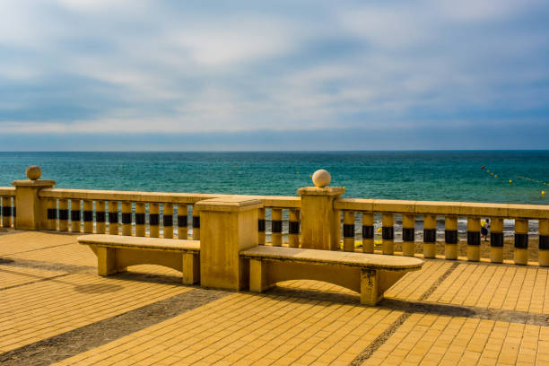 istock Empty benches on the beach, Sitges, Catalonia 1428672856
