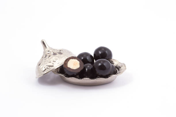 istock hazelnut in chocolate isolated on white background 1428673179