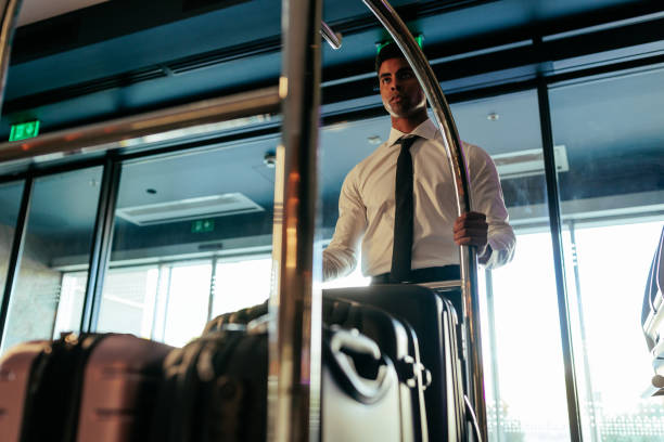 istock Hotel attendant tending to luggage. 1428673532