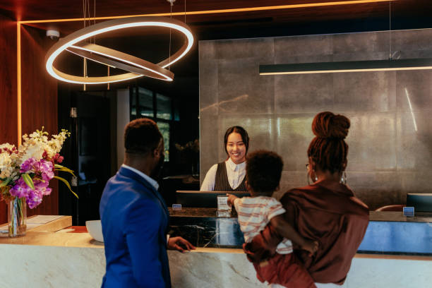 istock Wealthy couple checks into hotel. 1428675269