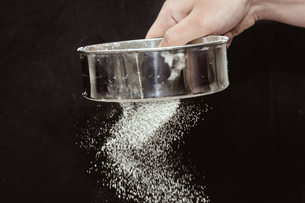 Close-up image of a modern kitchen sieve. The entire gadget is made of plastic. A shallow depth of field is intentionally used. No people.