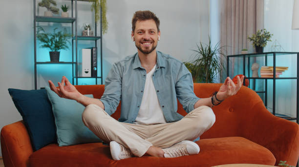 istock Man breathes deeply with mudra gesture, eyes closed meditating with concentrated thoughts peaceful 1428676544