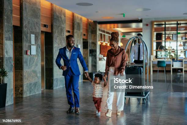 Family Going To Hotel Room With Luggage Stock Photo - Download Image Now - Hotel, Family, Travel