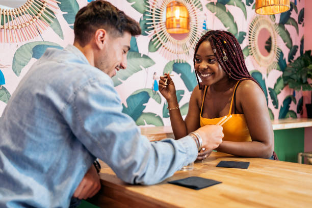 istock Friends Enjoying Poke Bowl 1428676989