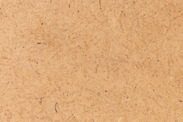 istock Brown cardboard sheet of paper background. 1428677532