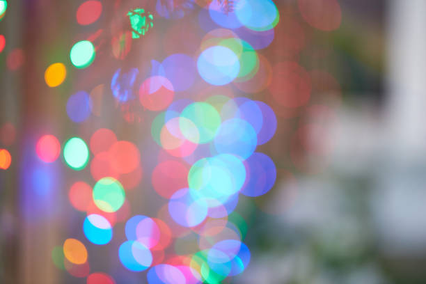 Colorful defocused bokeh lights in blur night background and celebration