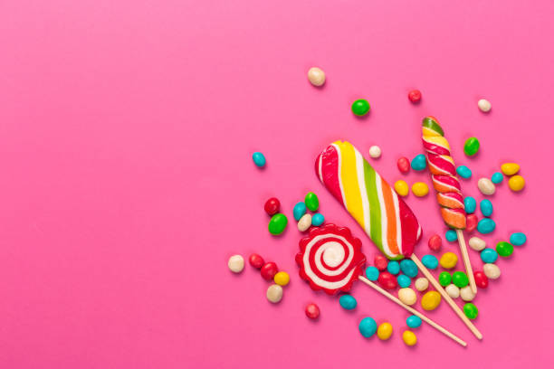 istock Colorful lollipops on a pink background 1428682898