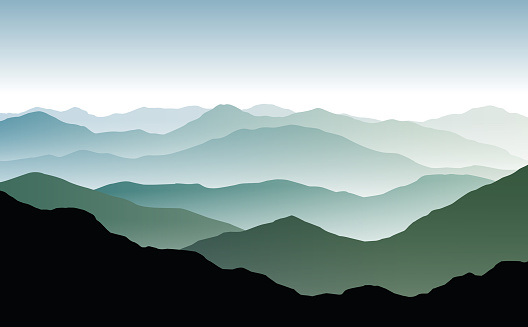 Vector panoramic landscape with blue and green misty silhouettes of mountains and clear sky