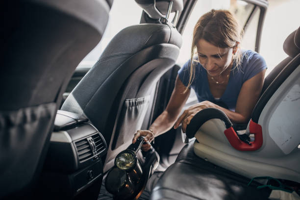 istock Cleaning car with cordless stick vacuum cleaner 1428685348