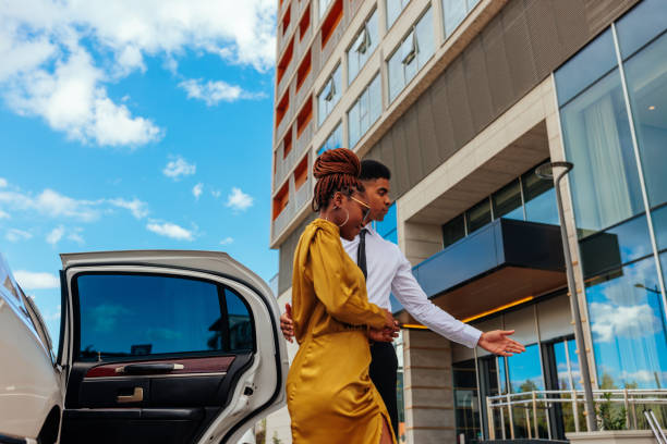 istock Valet escorting woman to hotel. 1428686616