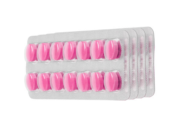 istock Pink tablet pills in blister isolated 1428687145