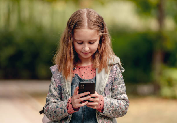 istock School girl with smartphone 1428687532