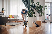 Cleaning wooden floor with wireless vacuum cleaner