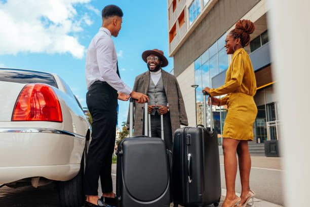 istock Limo driver and wealthy couple 1428689767