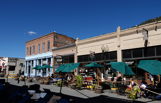 Idaho Springs, Colorado, USA-September 26, 2022: Traffic free main street with historic shops and restaurants in Idaho Springs, Colorado on a nice autumn day.