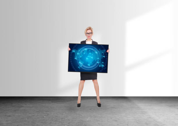 Businesswoman holding digital screen with a envelope icon on a world map interface. Global business and information technology concept