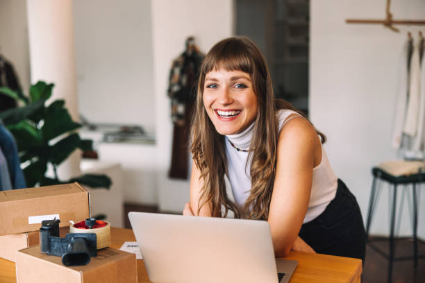 istock Happy clothing store owner smiling at the camera 1428698910
