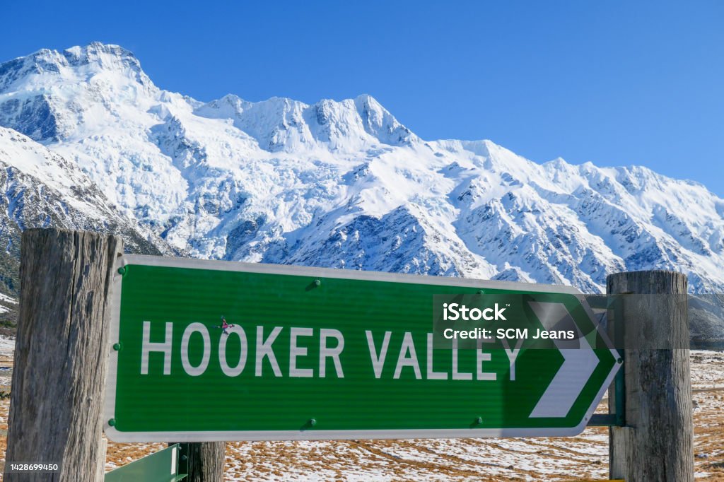 Hooker Valley Road sign pointing to the Hooker Valley in the Aoraki Mount Cook National Park. This image was taken on a sunny morning in early Spring. Beauty In Nature Stock Photo