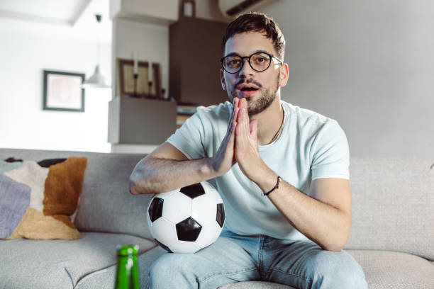 istock A picture of a tense young man watching a game 1428702187