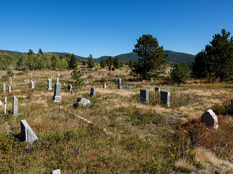 Johannishus, Sweden - February 14, 2015: Small white building on semetary. Grave stones in foreground.