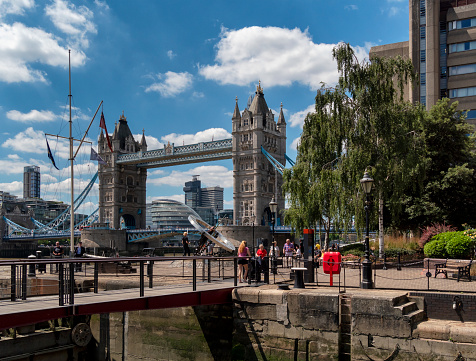 Tower Bridge seen from St Katharine Docks on a sunny summer day.