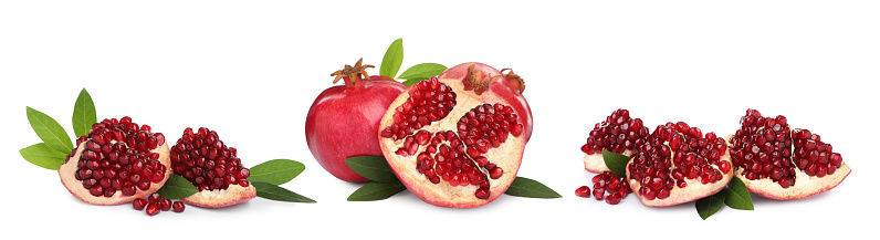 Set with tasty ripe pomegranates on white background. Banner design