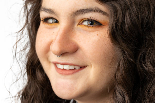 istock Beautiful young woman smiling into camera 1428719668