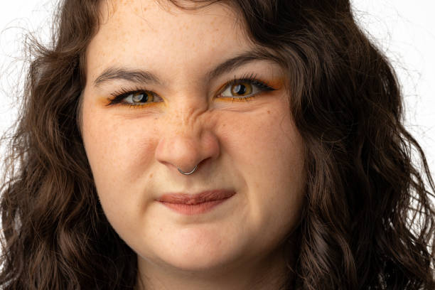 istock Young lady looking at camera with nose squished up 1428719699