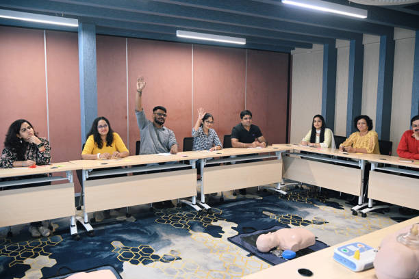 istock Adult learners asking questions during first aid CPR training 1428720078