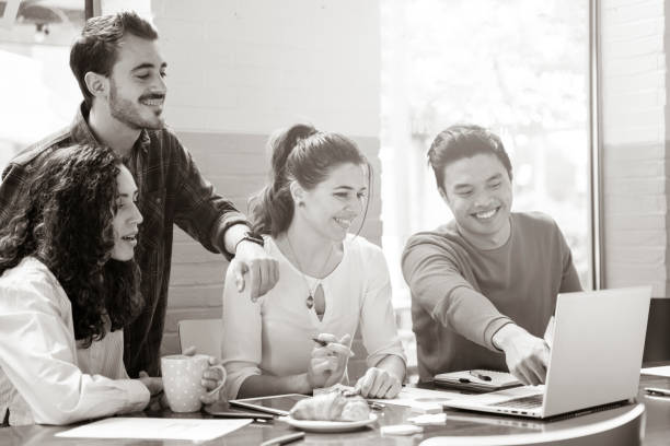 istock Young co-workers multiethnic team planning a new startup - Happy people working on a new project in creative coworking office - Marketing concept - Bright filter with focus on woman face at center 1428720402