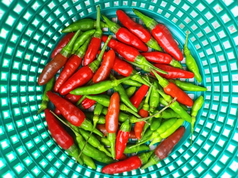 Red and Green Chili in basket - food preparation.