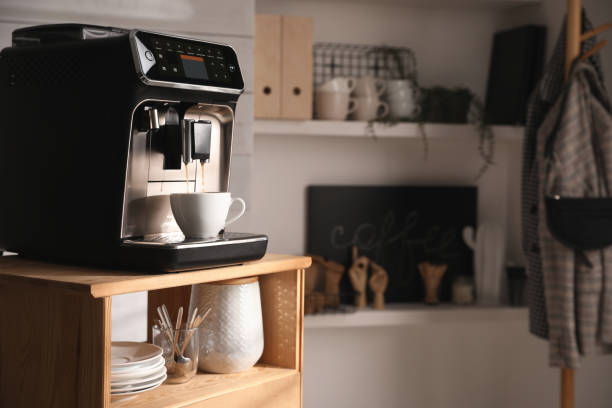 istock Modern coffee machine making tasty drink in office kitchen. Space for text 1428722071