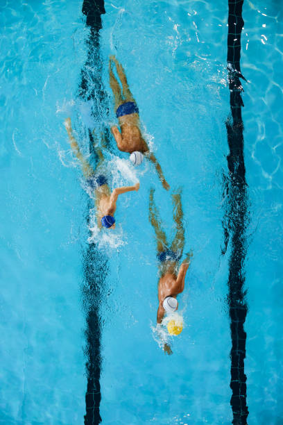 istock A forward water polo player succeeds at winning the ball. 1428724462