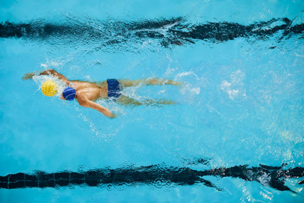 istock A water polo forward player drives the ball. 1428724519