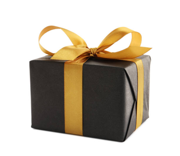 istock Black gift box with golden bow on white background 1428724669