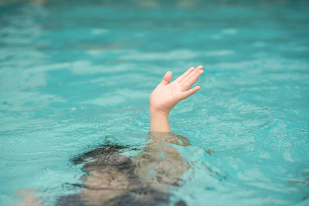istock emergency kid drowing in swimming pool show up hand call for help 1428726660