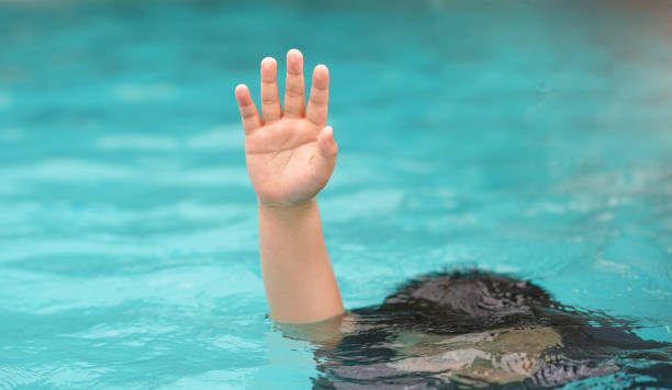 istock emergency kid drowing in swimming pool show up hand call for help 1428726696