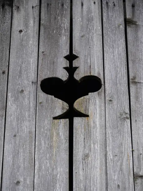 Photo of Traditional motif carved into wooden boards on a house in Triglav National Park, Slovenia