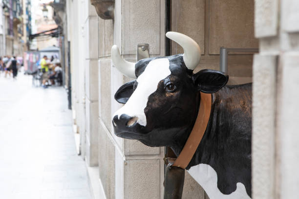 istock Model cow in a shop doorway 1428727823